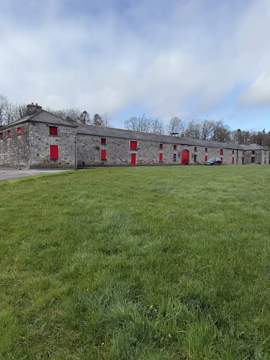 The farmyard with its red doors