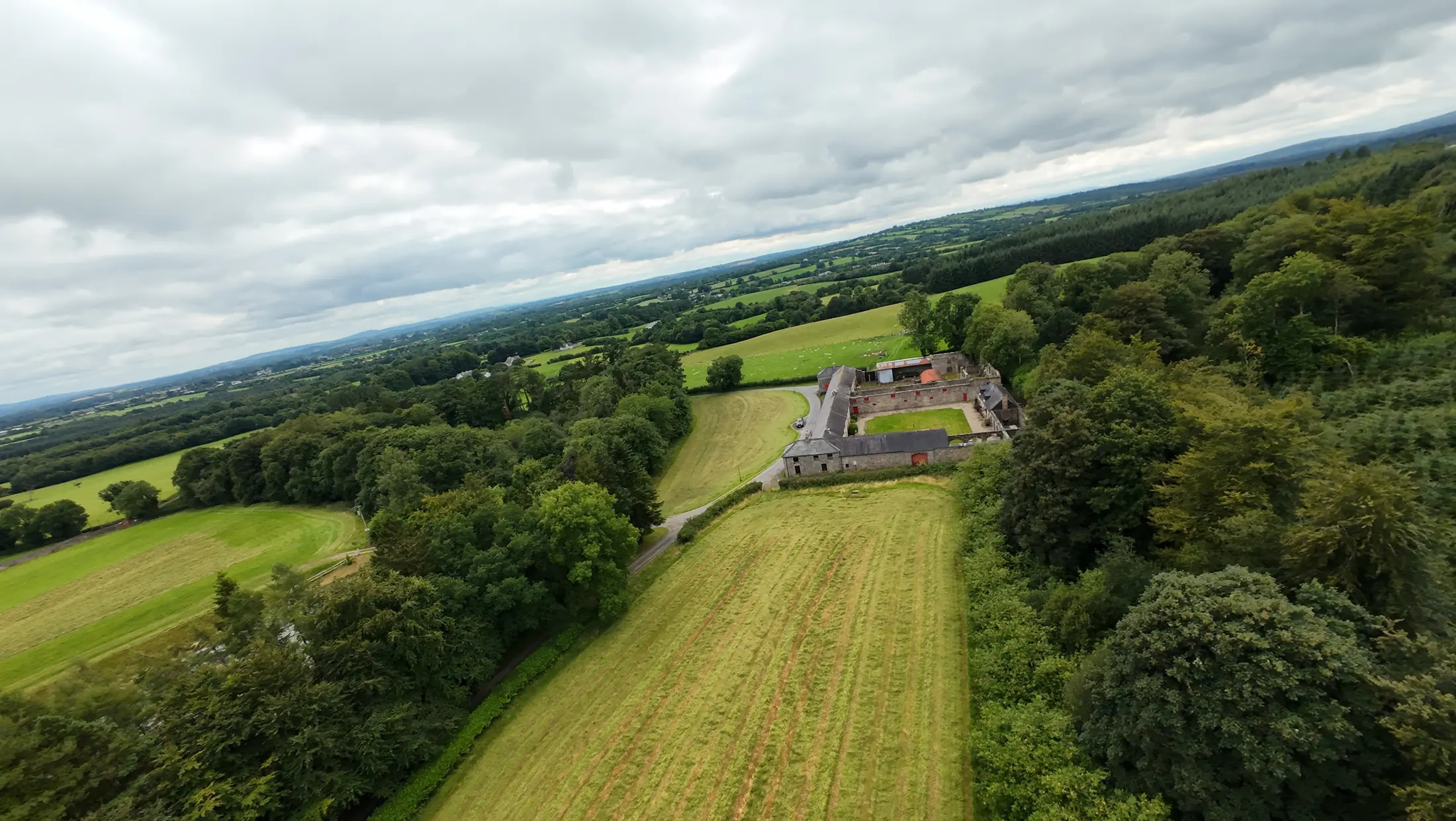 Deerpark from the air: the farmyard between woodland and hay meadows