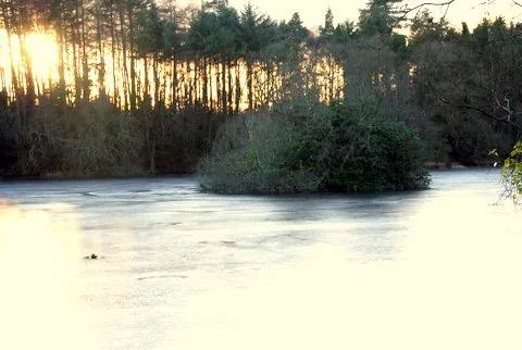 A frozen lake at sunset