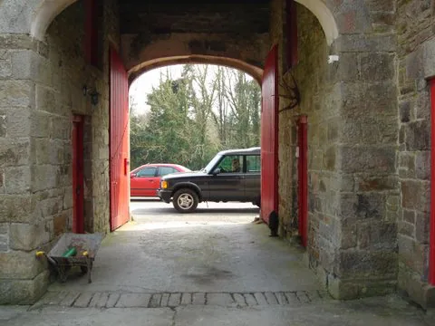 The arched gateway into the farmyard